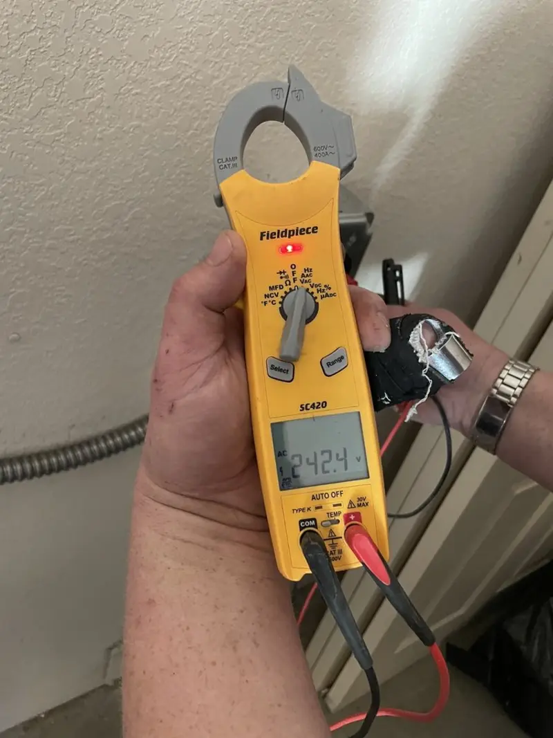 Voltage testing with clamp meter during Outlet Installation in Needles
